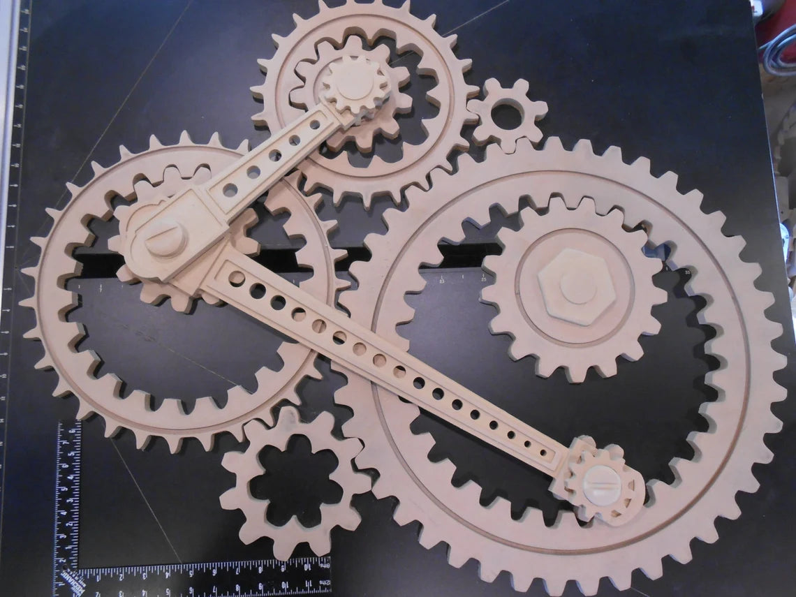 Wooden Gear Sculpture in Progress: 9 large wood gears; 2 coupling rods; 6 small accessories