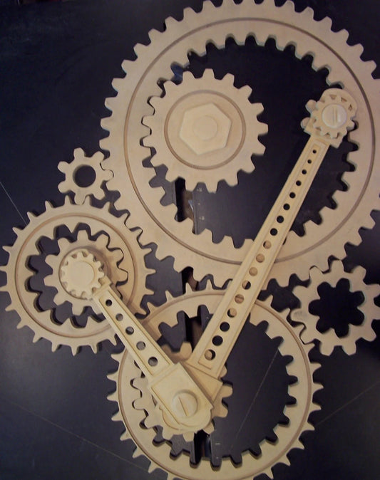 Wooden Gear Sculpture in Progress: 9 large wood gears; 2 coupling rods; 6 small accessories