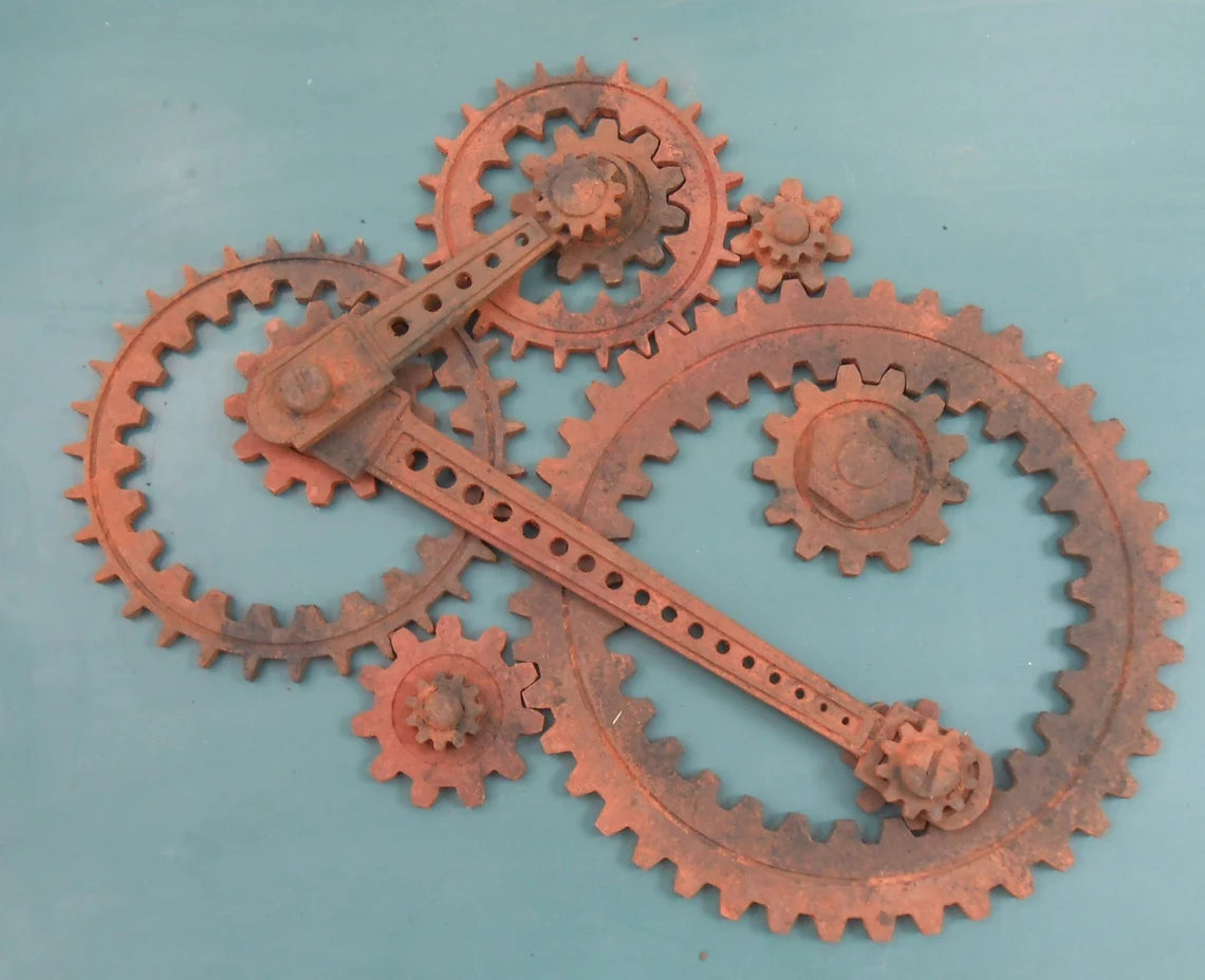 Wooden Gear Sculpture in Progress: 9 large wood gears; 2 coupling rods; 6 small accessories